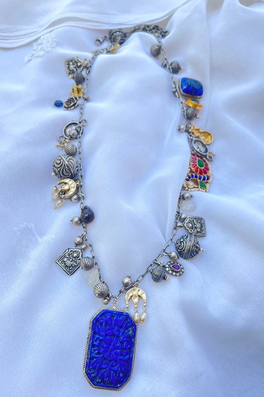 Charm Necklace with a carved Lapis Lazulli